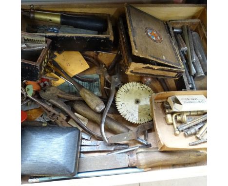 A shelf with 3 trays of various tools, including watch and clock maker's items, and 2 boxes of various tools and spares 
