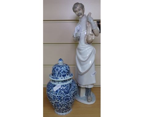 A Lladro doctor with a new born baby, 13.5", and a Delft jar 