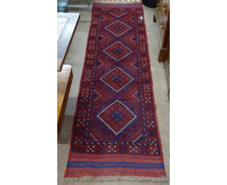 A Meshwani red ground runner, 241cm x 64cm 