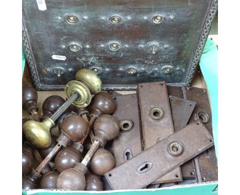 Brass and Bakelite door knobs, finger plates, and a light-switch panel 