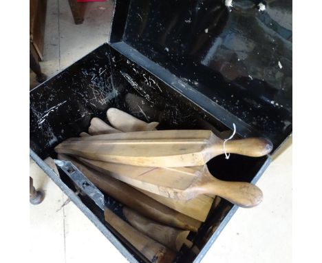 A tin trunk containing wooden boot trees 