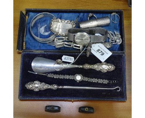 A group of silver items, to include silver-handled shoe horn and button-hook, cased, bangle, decanter label, bracelet, jewell