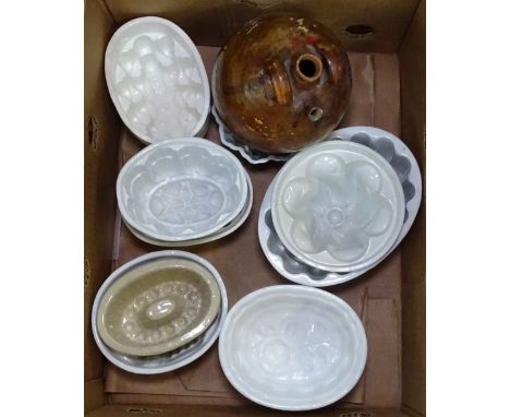Vintage jelly moulds and a flagon 