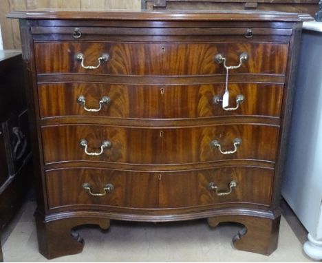A reproduction Georgian style mahogany batchelor's chest of serpentine form, with brushing slide, 4 long drawers under, cante