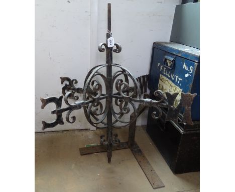 A blacksmith made scrolled wrought-iron weather vane 