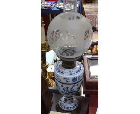 A Continental porcelain oil lamp with chimney and etched shade, 23.5" 