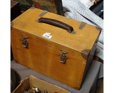 A wooden carrying case with carpentry tools, spirit levels etc 