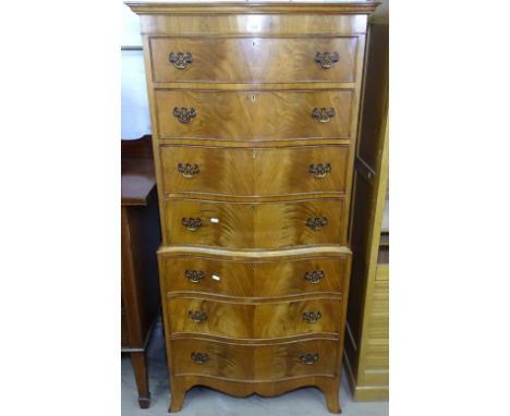 A mahogany serpentine-front 2-section chest on chest, with 7 fitted drawers, on bracket feet, W71cm 