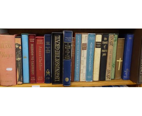 A shelf of folio books, including Kenneth Clark, Marco Polo, and Legends of the Grail 