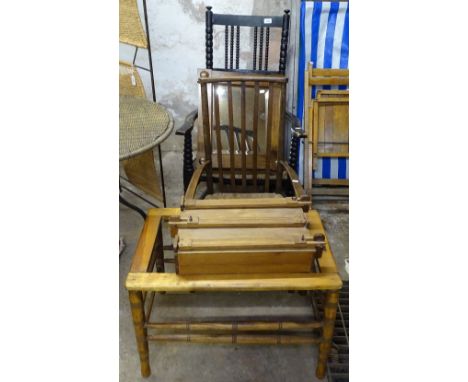 An ebonised rush-seated elbow chair, on bobbin turned legs, and another, a suitcase stand, and an artist's travelling easel/p