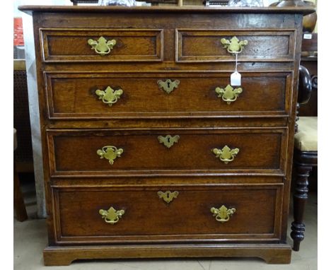 An 18th century joined oak chest, with 2 short and 3 long drawers, having moulded edge, raised on bracket feet, W93cm, H89cm,