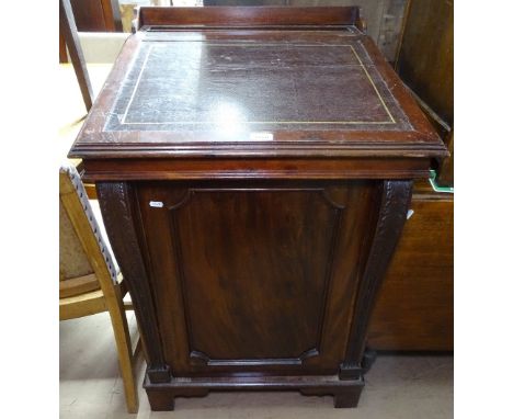 A mahogany clerk's writing desk, with rising lid and carved panelled door, on bracket feet, W63cm 