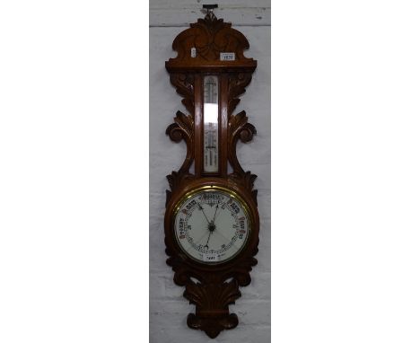 An acanthus leaf carved aneroid barometer, L90cm 