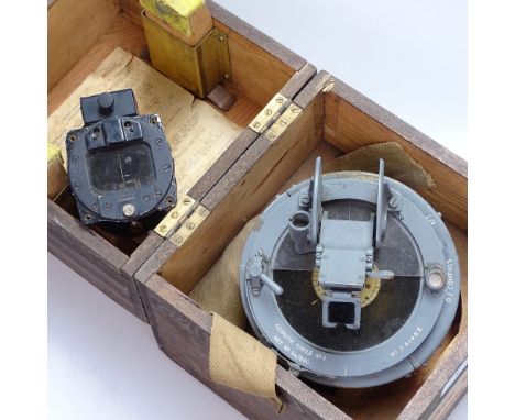 A gimballed pine-cased military compass, and a small Pioneer compass 