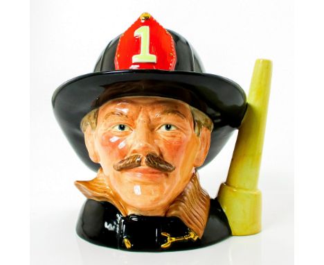 Style One. Black, brown and red helmet badge.Launched exclusively by Griffith Pottery House in 1983, The Fireman jug was then
