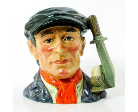 Black cap, blue jacket, white shirt, red scarf.This jug was modeled on the likeness of Grinder Rowland Swindon, a grinder fro