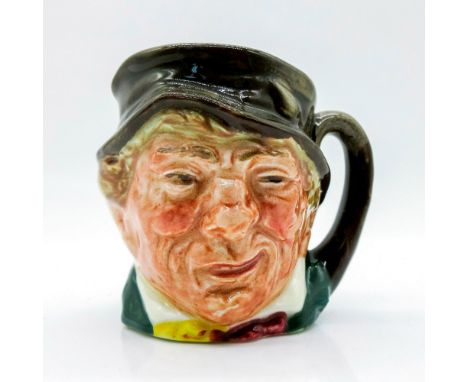 Brown hat; green coat; yellow and red scarf.Paddy, a colloquial term for an Irishman, is derived from St. Patrick, the countr