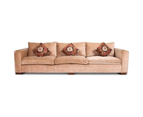 A LARGE UPHOLSTERED SOFA 66cm high, 313cm wide, 98cm deepTogether with four matching stools 38cm high, 35cm diameter  Conditi