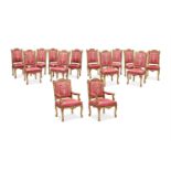 A SET OF FOURTEEN REGENCE STYLE CARVED GILTWOOD AND UPHOLSTERED CHAIRS, POSSIBLY FRENCH