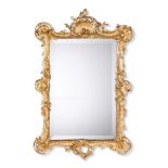 A FRENCH GILT COMPOSITION MIRRORIN LOUIS XV STYLE