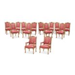 A SET OF FOURTEEN REGENCE STYLE CARVED GILTWOOD AND UPHOLSTERED CHAIRS, POSSIBLY FRENCH