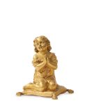 A GILT BRONZE FIGURE OF A CHILD KNEELING AND PRAYING