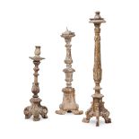 THREE ITALIAN BAROQUE CARVED SOFTWOOD ALTAR CANDLESTICKS, 17TH CENTURY AND LATER
