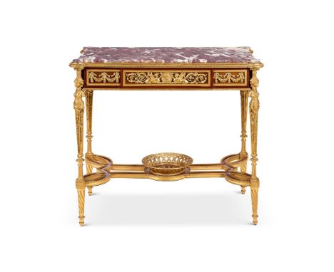A FRENCH ORMOLU MOUNTED AMARANTH AND PARTRIDGE WOOD CENTRE TABLE  AFTER THE MODEL BY ADAM WEISWEILER, POSSIBLY BY HENRY DASSO