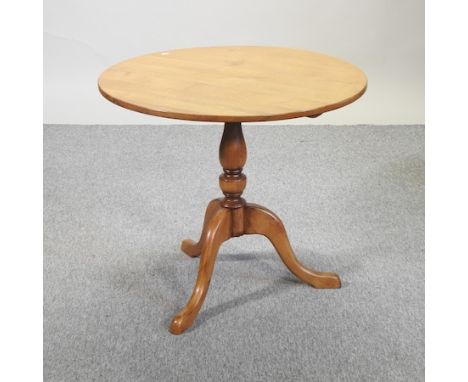 An oak occasional table, on a tripod base, 81cm