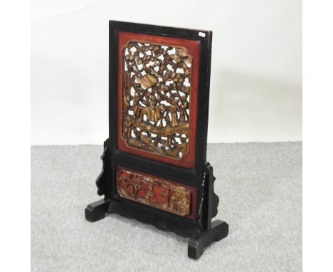 An early 20th century Chinese carved fire screen, 44cm