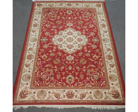 A Keshan style carpet, with floral design on red ground, 280 x 200