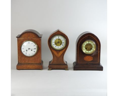 An Edwardian balloon shaped mantel clock, 34cm high, together with two mantel clocks and an American shelf clock