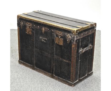 A 19th century leather and brass bound travelling trunk, 81cm