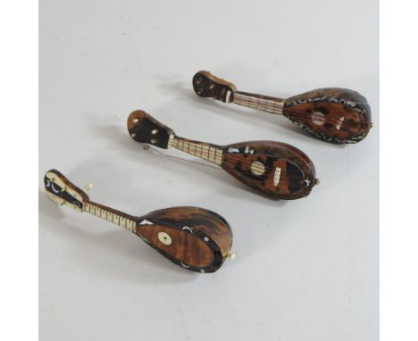 An early 20th century miniature model of a mandolin, 14cm, together with two others