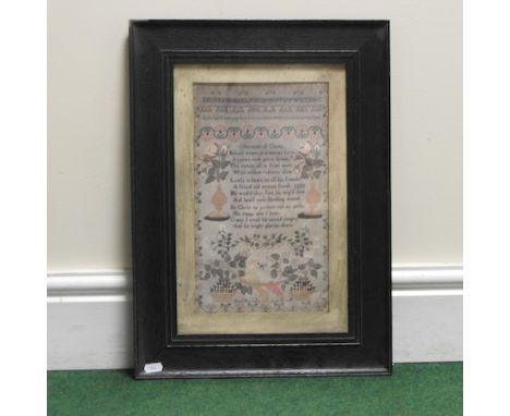 A framed print of a sampler, 33 x 19cm