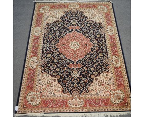 A Keshan style carpet, with floral design on blue ground, 280 x 200cm