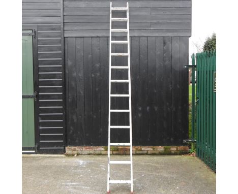An aluminium extending ladder, 700cm overall