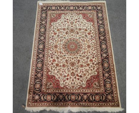 A Keshan style carpet, with floral design on a beige ground, 230 x 160cm