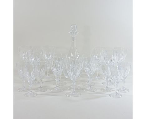 A collection of cut glass wine glasses and a decanter