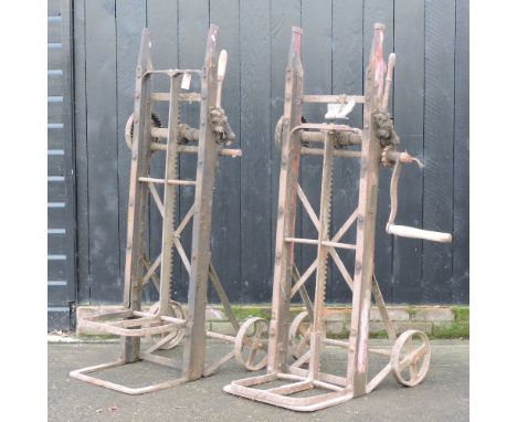 A vintage cast iron sack barrow, 156cm high, together with another smaller