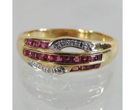 An 18 carat gold ruby and diamond ring, boxed