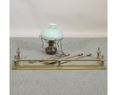 A brass fender, 114cm, together with a collection of brass fire tools, and a Victorian brass hanging lantern