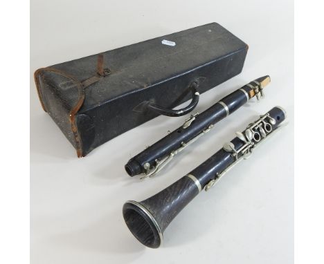A wooden clarinet, in a leather case