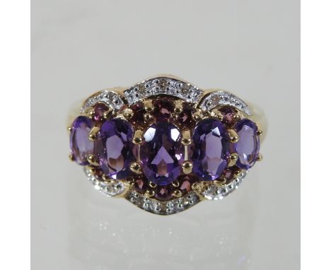 A 9 carat gold amethyst and diamond ring, boxed