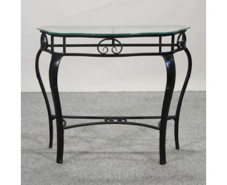 A metal console table, with a glass top, 88cm
