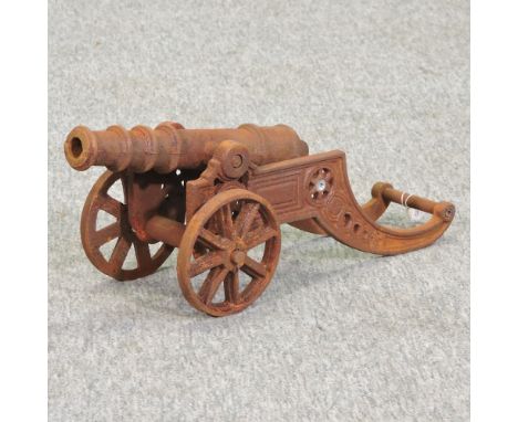 A rusted cast iron model of a cannon, 50cm long 