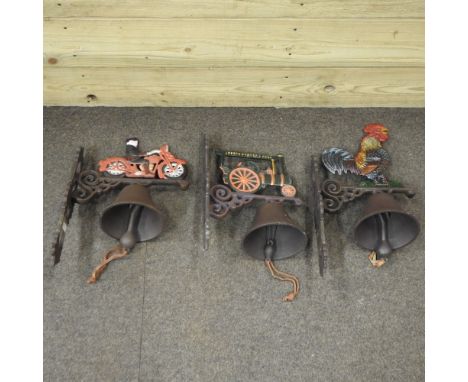 A set of three novelty painted metal door bells, in the form of a steam engine, a motorbike and a cockerel