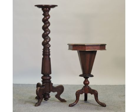 An early 20th century carved mahogany torchere, on a tripod base, 118cm high, together with a Victorian walnut trumpet shaped