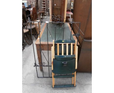 wrought iron gate and folding high chair