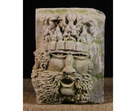 A Carved Architectural Stone block displaying the gaping face of the "Green Man" 12 ins x 9 ins x 7 ins (30 cms x 23 cms x 18